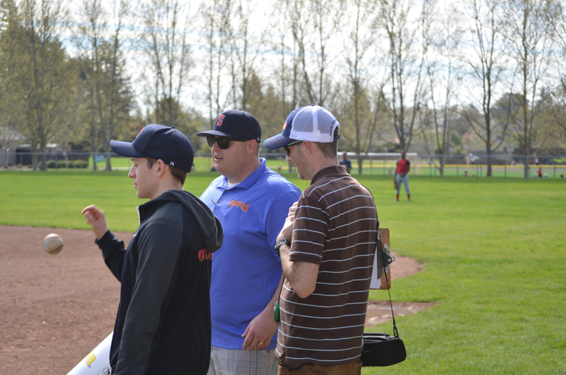 Ben Lindbergh, Sam Miller, and Sonoma Stompers general manager Theo Fightmaster look on from the sidelines at the tryout in March, perhaps plotting the Baptista heist.